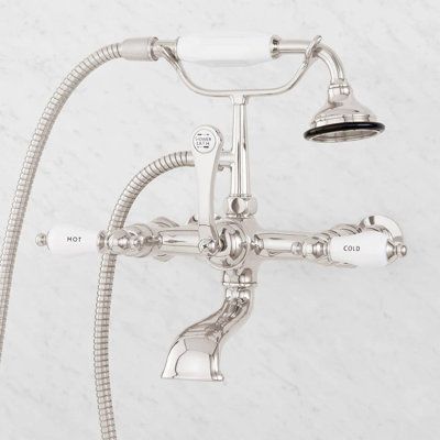 With porcelain lever handles and a beautifully sculpted design, this wall-mounted English-style tub faucet is sure to be the finishing touch in your bathroom suite. Finish: Polished Nickel Signature Hardware Telephone Style Wall Mounted Tub Faucet with Porcelain Lever Handles - Tub Only Faucets in Gray | Size 11.0 H x 7.0 W in | Perigold Clawfoot Tub Shower, Shower Vintage, Wall Mount Tub Faucet, Copper Faucet, Metal Tub, Shower Style, Style Anglais, Shower Diverter, Acrylic Tub