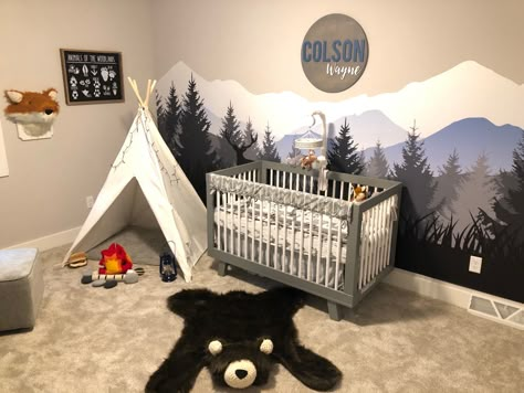 Boys wilderness nursery idea with wall mural, faux taxidermy fox, bear skin rug, tent, and camp fire. Wilderness Nursery, Camping Nursery, Baby Bear Nursery, Boy Nursery Themes, Mountain Mural, Baby Room Themes, Baby Boy Nursery Decor, Woodland Nursery Theme, Nursery Room Design