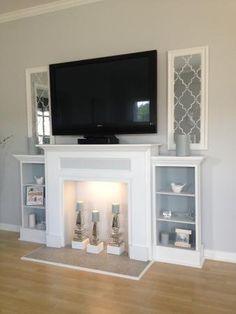 Love this faux mantle with candles and side shelves for a fireplace! #DIY #PLANS #PROJECT Faux Mantel, Faux Mantle, Fireplace Diy, Fake Fireplace, Faux Fireplace Diy, Side Shelves, Faux Fireplace, Diy Fireplace, Christmas Fireplace