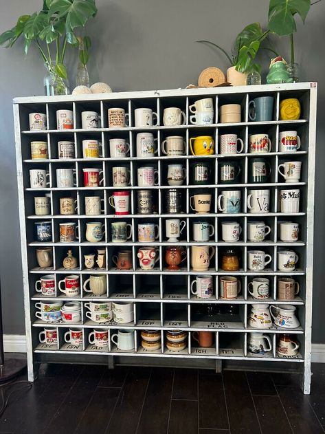 My Pride And Joy The Display Is An Antique Postmasters Sorting Cabinet From The Early 1900s Coffee Mug Display Cabinet, Mug Display Ideas, Mug Collection Display, Best Thrift Store Finds, Mug Cabinet, Tea Cup Display, Diy Sharpie Mug, Coffee Mug Display, Mugs Ideas