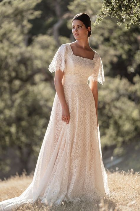 Become a bohemian dream bride in this dreamy lace gown, with an A-line skirt and flirty cap sleeves | wedding dresses 2023, 2023 wedding gown, designer wedding dresses, romantic wedding dress, A-line wedding dress, elegant wedding dress classy, cool bride style, lace wedding dress, wedding dress with lace appliques, romantic wedding dress, small romantic wedding, tulle wedding dress, winter wedding, proposal season, delicate wedding dress, wedding dress #floralweddingdress #delicateweddingdress Modest Bridal, Allure Bridals, Modest Wedding, Wedding Dress Sizes, Allure Bridal, Modest Wedding Dresses, A Line Gown, Lace Gown, Boho Wedding Dress