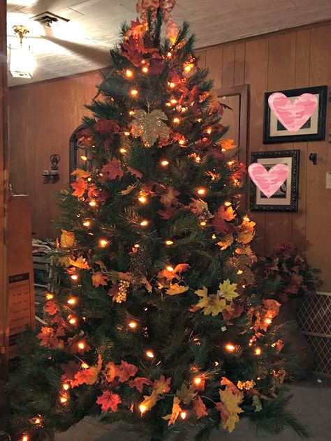 Fall/Autumn Tree (A Christmas Tree). Orange lights (around 4 boxes, for a 7.5 ft tree). Decorated fall garland (I have around 6 strands on it).  Add a bow (if you want) of your choice. This one is handmade for 9 ft. ribbon. Christmas Tree Orange, Fall Tree Decorations, Tree Orange, Fall Leaf Garland, Fall Tree, Fall Garland, Autumn Tree, Fall Thanksgiving Decor, Leaf Garland