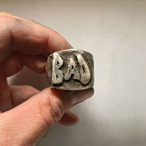 It’s a statement ring bursting with attitude. Made of solid Sterling silver, our BAD ring is large, with a thick band that demands... Lip Ring Men, Rough Rings, Strange Rings, Edgy Rings, Vintage Jewelry Rings, Biker Jewelry, Ring Mens, Gold And Silver Rings, Statement Ring Silver