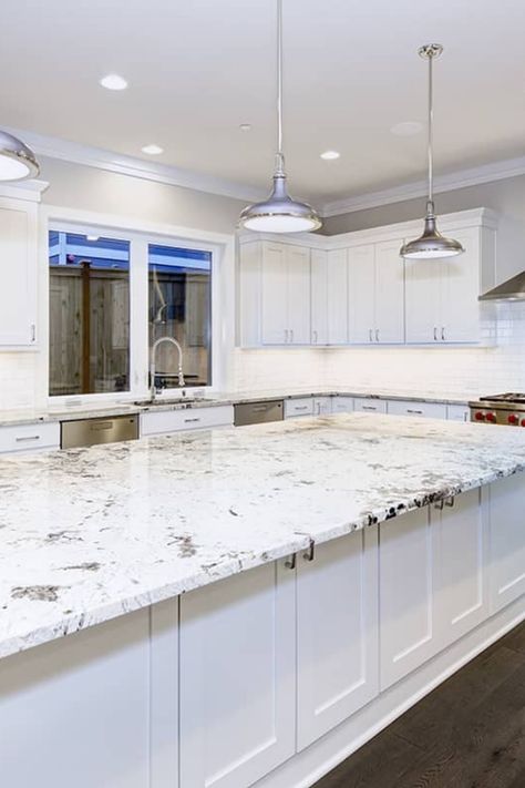 While granite is a highly durable material, you might desire a new color to match a kitchen renovation or update. This article will show you how to change the color of your granite countertops, offering a cost-effective alternative to replacement. Changing Granite Color Countertops, Change Granite Countertop Color, White Orion Granite Countertops, Luna Pearl Granite, Tan Brown Granite, Brown Granite Countertops, White Granite Countertops, Black Granite Countertops, Kitchen Cabinets And Countertops