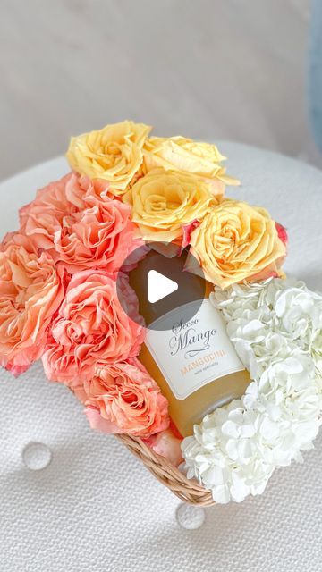 Stephanie Veltri on Instagram: "Like & comment “SHOP” to instantly receive links in your DM. 💗

This is such a great gift for autumn that will take you through Thanksgiving.  By simply using a basket filled with crinkle paper, a block of floral foam, plastic wrap, orange garden roses, yellow roses, a few sprigs of white hydrangeas, and a bottle of mango secco Mangocini from TJ’s you’re all set for the perfect hostess gift! 🧡🍁🍂

Supplies:

-1 block of floral foam
-1 basket that fits the foam
-plastic wrap
-1 long bread knife
-a sharpie pen
-a bowl filled with water that will accommodate the size of the floral foam

-1 bottle of Mangocini, wine or champagne 

-6 orange garden roses
-6 white hydrangea sprigs
-6 yellow roses

*Trim all of the stems at about 2-3 inches to fit in the foam pr Roses Yellow, Orange Garden, Perfect Hostess, White Hydrangeas, Rose Centerpieces, Sharpie Pens, Crinkle Paper, Floral Foam, Orange Roses