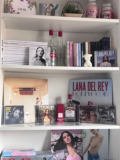 Music Shelf Aesthetic, Coquette Room Shelves, Aesthetic Bedroom Bookshelf, Lana Bedroom Aesthetic, Coquette Bookshelf Aesthetic, Bookshelf Room Aesthetic, Lana Del Rey Dorm Room, Lana Del Rey Aesthetic Room Decor, Aesthetic Bookshelf Bedroom