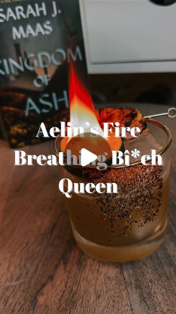 Amanda’s Bookish Bar Cart on Instagram: "Aelin’s Fire Breathing Bî*ch Queen Cocktail❤️‍🔥❤️‍🔥❤️‍🔥

I love Throne of Glass with my whole heart. I have been putting off doing Aelin’s cocktail because it’s daunting and I wanted to make sure to do her justice! 

I made a hot honey grilled pineapple margarita. You will get notes of smokiness from the mezcal, spice from the hot honey and a caramelized sweetness from the grilled pineapple. Also the color matches Aelin’s golden dress so well😄 

Ingredients:
1 pineapple, cored and cut into rounds(you can use canned but fresh is better!)
1.5 oz tequila (I used @tequilaocho)
.5 oz mezcal
.5 oz fresh lime juice
.5 oz hot honey 
Grilled pineapple piece for garnish
Lime and Tajin to rim glass

Method:

Cut ends off pineapple. Then cut off the thick o Pineapple Simple Syrup, Queen Cocktail, Pineapple Margarita, Cut Pineapple, Fire Breathing, Golden Dress, Hot Honey, Grilled Pineapple, Whole Heart