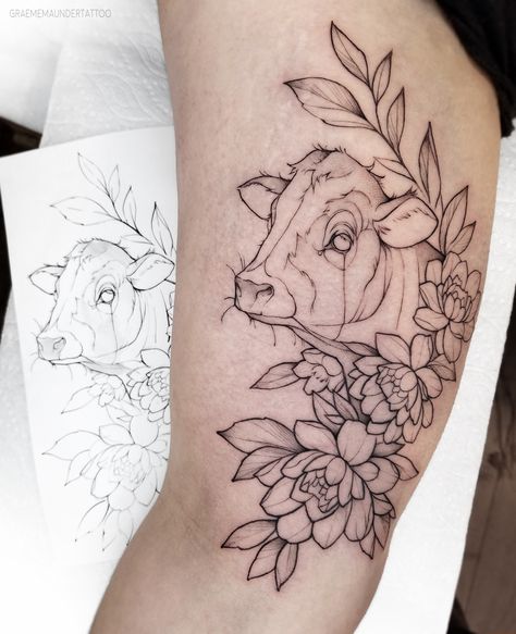 Simple blackwork cow and mixed florals tattoo. Clean and lighted shaded.   (by Graeme Maunder)  #vancouvertattooartist #tattoo #tattoos #tattooing #floraltattoo #tattooartist #tattooart #tattoodo #tattooist #blackworktattoo #tattooed #tattooed #tattooartist #cowtattoo #cow #floraltattoo Highland Cow Tattoo, Bull Tattoo, Simple Tats, Cow Tattoo, Elements Tattoo, Bull Tattoos, Western Tattoos, C Tattoo, Tattoo Minimal