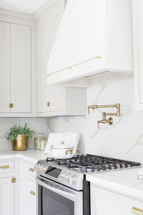 Contemporary Neutral Kitchen with White Custom Range Hood Wood Range Hood, Custom Range Hood, Neutral Kitchen, Tudor Style Homes, Kitchen Range Hood, Sleek Kitchen, Pot Filler, Kitchen Hoods, Kitchen Range