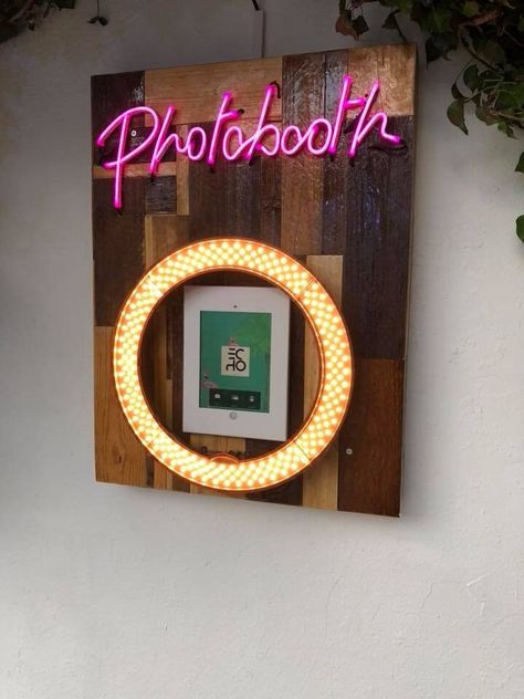 This is a handmade photo booth wall mount made specifically for permanent photobooth installations with iPad's. It features a pink neon photo booth sign which is built into the rustic wooden mount and comes with 70mm depth to allow all wiring to be neatly stored behind the bored. It comes with a Newer 18 Inch ring light and a choice of ipad casings (9.7, 10,5, 12.9) All parts of this booth are custom made to your specifications. The size of this particular board is 900mm X 650mm which we find is Neon Photobooth, Neon Photo Booth, Rustic Photobooth, Photo Booth Diy, Photobooth Decor, Photobooth Sign, Photo Booth Wall, Ring Light Photo, Neon Photo