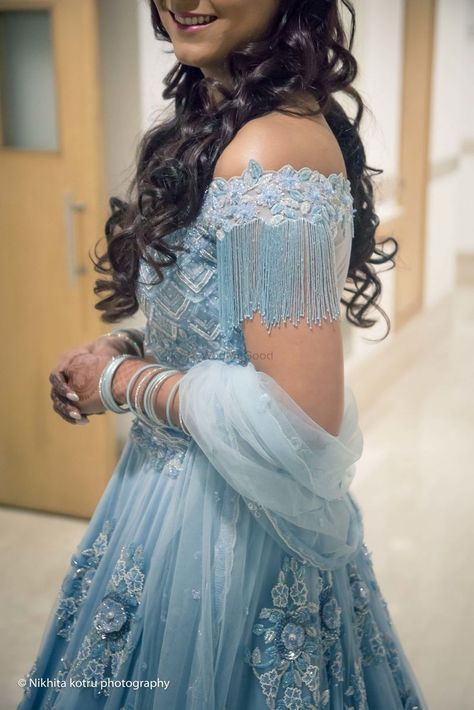 Photo of Light blue engagement lehenga with tassels on sleeve Blue Engagement Lehenga, Sky Blue Lehenga, Engagement Lehenga, Indian Wedding Gowns, Lehnga Dress, Wedding Blouse Designs, Blue Lehenga, Indian Bridal Dress, Indian Gowns Dresses