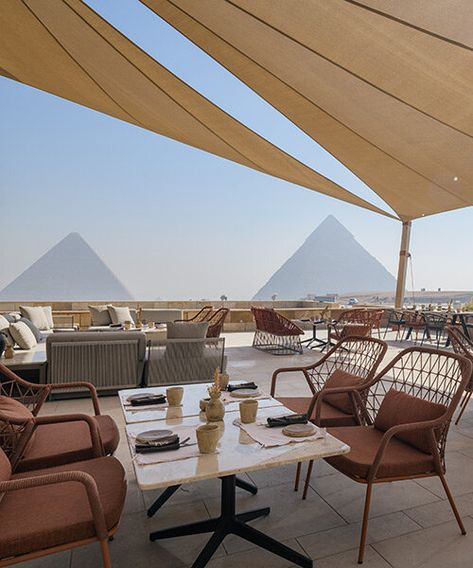 history meets contemporaneity as pedrali's furniture decorate the restaurant, highlighting the earthy tones and calming atmosphere of the space. Giza Egypt, Egyptian Pyramids, Giza, Coffee Shops, Architect Design, Earthy Tones, Fine Dining, Style Design, Pyramid