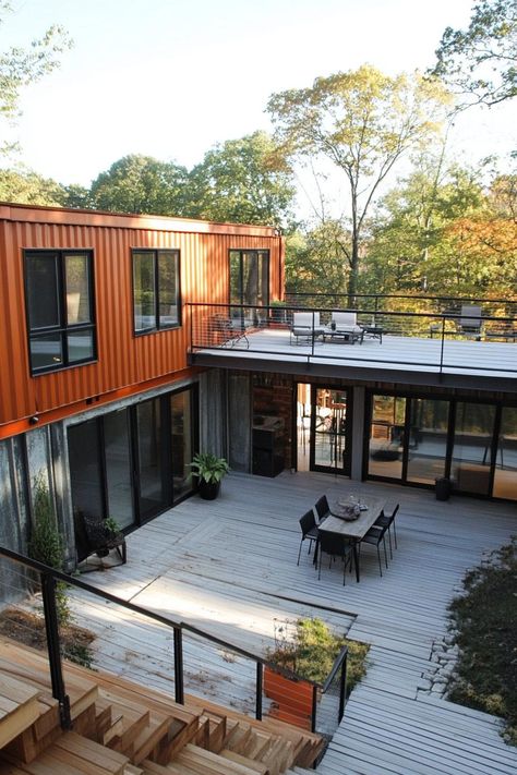 Modern shipping container home courtyard with decks and porches. Check out these shipping container homes and learn their advantages, design appeal, and unique characteristics. Container Home With Deck, Cabin Garage, Home Courtyard, Shipping Container Design, Container Cabin, Shipping Container House Plans, Shipping Container Home, Building A Container Home, Container Architecture