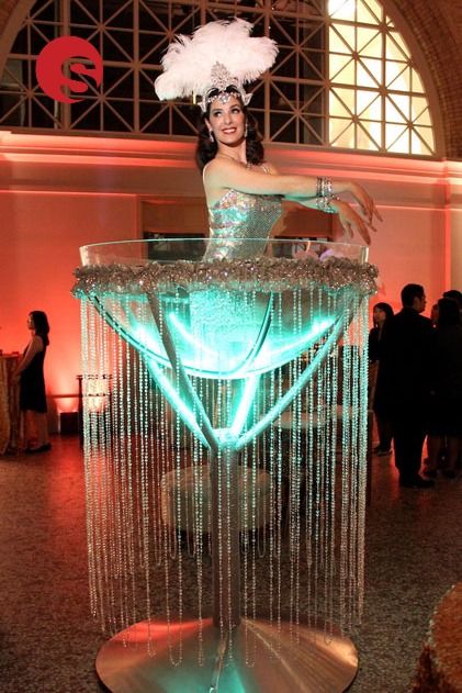 Our giant martini glass is the one of most glamorous entertainment options for your James Bond themed party! Our martini glass burlesque performer is part living décor and installation art. The enormous martini glass can be used for a glamorous entranceway, bar centrepiece, focal point and as interactive entertainment to ensure your guests have the time of their lives at your event! Circus Theme Party Adults, Burlesque Party Decorations, Burlesque Theme Party, Burlesque Theme, Christmas Entertainment, Burlesque Party, James Bond Party, Burlesque Costumes, Amigurumi Animals