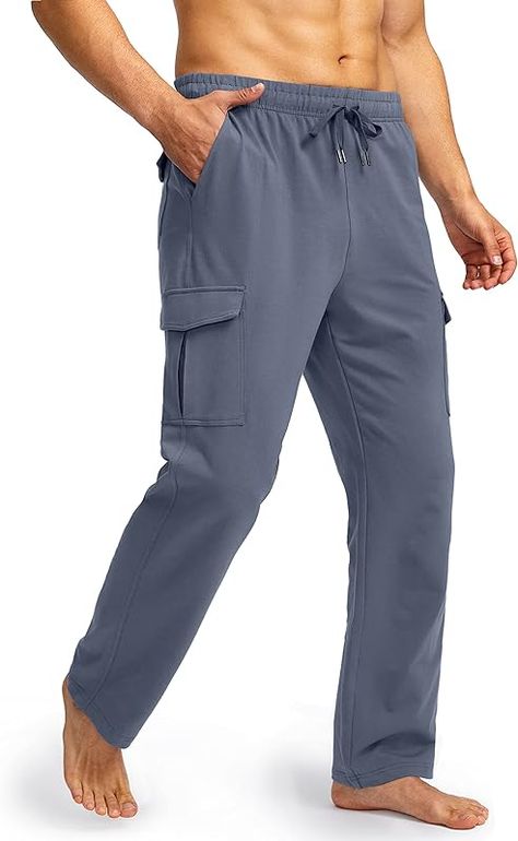 92% Cotton, 8% Spandex Imported Drawstring closure Cargo Sweatpants: Soft, skin-friendly and loose fit blended cotton sweatpants wicks sweat from your skin, keeps you dry and warm in Winter. Cargo Pockets: Total 6 pockets including 2 slant pockets and 4 cargo pockets with velcro, provides security storage for your phone, wallets, credit card, keys, etc. Four-way Stretch: Stretch fabric allows for free movement, open bottom jersey sweatpants keep you comfortable while lounging around the house. Adjustable Waistband: Elastic waistband with drawstring provides a custom fit, offers great mobility for straight leg sweatpants. Occasion For: Pudolla Men Sweatpants perfect for yoga, lounge, workout, running gym, exercise, and casual wear. Mens Workout Pants, Cargo Sweatpants, Tapered Joggers, Running Shorts Men, Strong Legs, Free Movement, Men's Sweatpants, Cotton Sweatpants, Athletic Workout