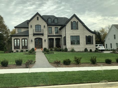 Exterior coloring (light brick, dark trim) Light Brick With Dark Trim Exterior, Light Brick House Exterior Dark Trim, Brick House With Black Trim, House Exterior Dark, Light Brick House Exterior, Gray Brick House Exterior, Grey Brick House Exterior, House With Black Trim, Grey Brick Houses