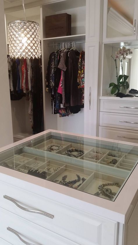 A see through center island counter top, allowing you to view your precious jewelry at a glance.    Designed by Senior Designer Jeanne Hessen  Learn more: https://www.closetfactory.com/custom-closets/ Closet Island Jewelry Drawers, Center Closet Island, Closet Island Glass Top, Closet Island With Jewelry Storage, Walk In Closet Center Island, Closet Island With Glass Top, Jewelry Island In Closet, Closet Center Island, Island In Closet