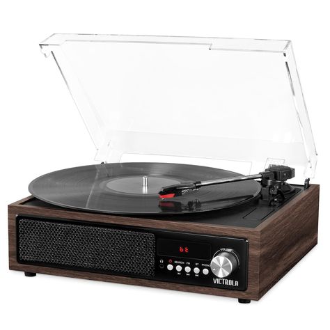 "Enjoy the nostalgic sound of vinyl with this Victrola 3-in-1 Bluetooth Record Player with Built-in Speakers.Enjoy the nostalgic sound of vinyl with this Victrola 3-in-1 Bluetooth Record Player with Built-in Speakers. 3-speed turntable (33 1/3, 45, 78 RPM) plays all of your favorite vinyl records Record from vinyl directly to USB, no computer needed Wirelessly stream music from your Bluetooth enabled device FM radio Built-in stereo speakers and RCA output WHAT'S INCLUDED Record player Power adap Bluetooth Record Player, Clear Top, Electronic Recycling, Record Players, Cabinet Styles, Wooden Cabinets, Built In Speakers, Stereo Speakers, Record Player