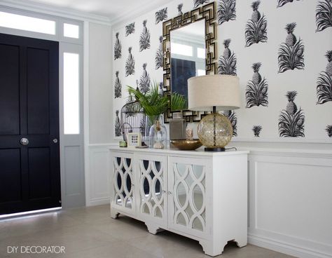 This tropical hallway in Brisbane makes a statement with a stunning black and white pineapple wallpaper background and a mirrored console. Amazing Hallways, Tropical Hallway, Tropical Mirror, Pineapples Wallpaper, Wallpaper Dining Room, Vintage Tropical Decor, Tropical Chic Decor, Tropical Room Decor, Hallway Room