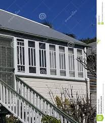 Enclosed Verandah on Queenslander Stock Photo - Image of enckosed, white: 99264788 Enclosed Verandah Ideas Australia, Verandah Ideas Australia, Enclosed Verandah, Old Queenslander, Verandah Ideas, Top Of Stairs, Painted Windows, Front Verandah, Wooden Stairs