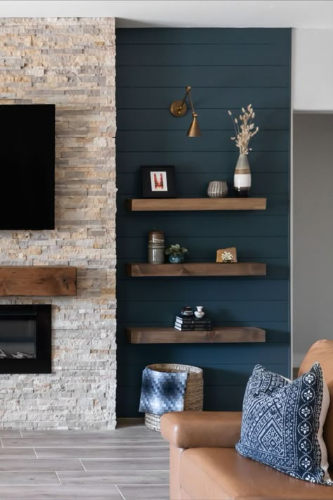 This gorgeous saturated blue/green hue is exactly what this space needed to both modernize the paneling on the focal wall as well as create repetition throughout this client home. Visit our blog to see how the rest turned out! Dark Accent Wall Living Room, Wall Niches Ideas, Blue Accent Wall Living Room, Niches Ideas, Fireplace Accent Walls, Wall Niches, Teal Accent Walls, Fireplace Feature Wall, Dark Accent Walls