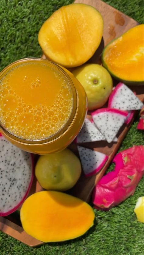 Mason jar filled to the top with an orange color golden juice surrounded by fruit aesthetic of lemon dragon fruit and mango Dragon Fruit Juice Recipe, Mango Refresher, Dragon Fruit Lemonade, Dragon Fruit Juice, Dragonfruit Recipes, Fruit Lemonade, Dragon Fruit Benefits, Fruit Mango, Fruit Juice Recipes