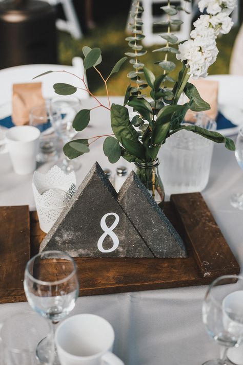 Adventure Table Decorations, Modern Mountain Wedding Decor, Diy Mountain Wedding Decor, Mountain Wedding Decorations Table, Mountain Centerpieces Wedding, Concrete Table Numbers, Mountain Wedding Centerpieces, Mountain Centerpieces, Concrete Wedding Decor