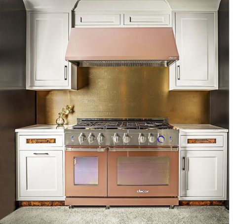 Rose gold, brass, and copper finishes are officially here on gadgets, hardware, and appliances like this new range, from Dacor.  Even the lustrous black stainless from KitchenAid, Gold Kitchen Appliances, Rose Gold Kitchen Appliances, Copper Kitchen Appliances, Copper Kitchen Faucets, White Kitchen Appliances, Rose Gold Kitchen, Outdoor Kitchen Appliances, Popular Kitchens, Big Kitchen