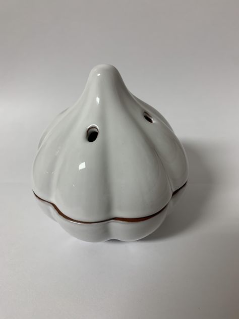 PRICES MAY VARY. KEEP GARLIC FRESH: This ceramic garlic keeper allows cloves to breathe through small holes to stay fresh on your counter for longer than storing in a bag or container DURABLE DESIGN: Made of glazed ceramic, the charming garlic shape design is durable for long-term use while adding a cute touch to your kitchen decor. PERFECT STORAGE: Holds just the right amount for frequent use - one large or two small cloves - without taking up too much counter space. EASY CLEANING: Its dishwash Garlic Dish Pottery, Ceramic Garlic Keeper, Garlic Pottery, Garlic Container, Garlic Holder, Garlic Tool, Garlic Keeper, Flour Canister, Kitchen Objects