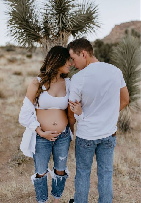 Maternity Shoot Belly Out, Outdoor Jean Maternity Shoot, Maternity Pic Outfit Ideas, Maternity Pics Outfit, Maternity Pictures In Jeans Outfit, Maternity Jeans Photoshoot Couple, Water Maternity Pictures Jeans, Maternity Photo Shoot In Jeans, Maturity Photoshoot Jeans