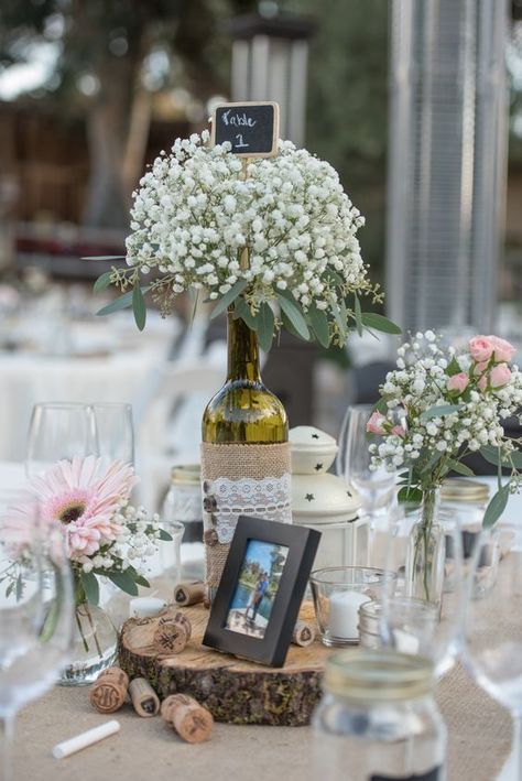 Wine Bottle Centerpieces with Baby's Breath / http://www.himisspuff.com/rustic-wedding-centerpiece-ideas/20/ Amazing Wedding Centerpieces, Wine Bottle Wedding Centerpieces, Vineyard Wedding Decor, Wine Bottle Centerpieces, Wedding Wine Bottles, Bottle Centerpieces, Wedding Unity, Wedding Bottles, Candle Table