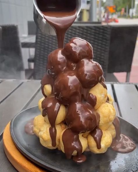 Food Network - Bubbling Chocolate Profiterole Tower | Facebook Profiteroles Tower, Profiterole Tower, Crispy Pata, Ultimate Burger, Profiterole, Taco Cups, Cream Puff, Crispy Treats, Cooking Channel