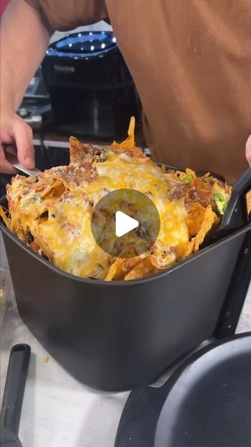 Yumm hannafest on Instagram: "Ready to Dive into 21-Layered Air Fryer Nachos? 🧀🥑🌶️  #nachos #airfryer #recipe #snack #foodie  Indulge in this 21-layered air fryer nachos extravaganza! 🧀🥑🌶️ Are you ready to dive into this delicious snack sensation? Let’s make some nachos magic happen!  Layers below (makes a lot of nachos)  2 bags of Doritos (you chose the flavor) 2 cups salsa verde 1 pound tacos seasoned ground beef 1 cup black beans 4 cups grated Mexican blended cheese 1 cup pickled jalapeños 1/2 cup fresh jalapeños 1 cup diced onions 1/2 cup sour cream 1 cup pico de gallo 1 cup guacamole" Nacho Airfryer, Oven Nachos Recipes, Airfryer Nachos, Layered Nachos, Beef Nachos Recipe, Air Fryer Nachos, Nachos Recipe Beef, Airfryer Recipe, Baked Nachos