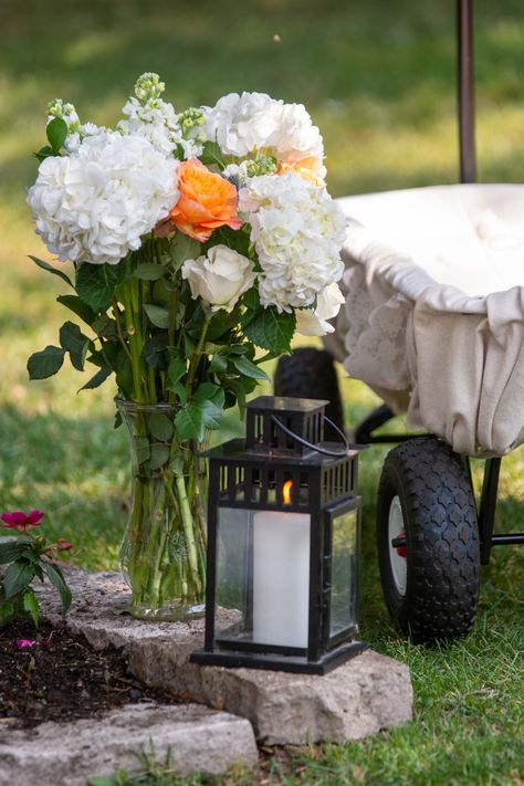 We used Garden roses, hydrangea, white stalks, and greenery for the vase (which I got at goodwill for $2)!! We also used a classic red wagon for the flower girl wagon!! I used some fabric and lace and secured it with magnets! Flower Girl Wagon, Summer Wedding Decor, Hydrangea White, Outdoor Summer Wedding, Summer Wedding Decorations, Summer Wedding Outdoor, Red Wagon, Outdoor Summer, Garden Roses