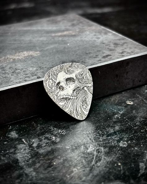 The ghoulish strummer Another guitar pick from yesterday’s batch. Made out of 20g spring hard .925 sterling silver . . . . . . . . #guitarpick #silver #sterlingsilver #ghoulish #guitarist #guitar #skull #personalized #customguitarpicks #musician #gift #giftidea #giftideas #sooke #sookebc Silver Guitar, Guitar Picks Personalized, Custom Guitar Picks, Steel Guitar, Skull Fashion, Guitar Picks, Silver Engraving, Skull Design, Guitar Pick