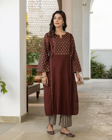 Earthy Tones - New Arrivals! A striking rust kurta with a flattering princess line silhouette. The solid color of the kurta acts as a bold base for the printed yoke and sleeves. Cuffs are elegantly finished with a printed flat piping. This kurta will ensure you will feel comfortable and chic. [ Cottons, Cottons Jaipur, New Arrivals, Fine Twill, Winterwear, Earthy Tones, Shop now ] #cottons #cottonsjaipur #newcollection #newarrivals #handcrafted #earthytones #kurta #suitsets #shopnow #comfo... Cottons Jaipur, 2025 Summer, Princess Line, Cotton Long Dress, Kurti Design, Patch Work, Kurti Designs, Earthy Tones, Winter Wear