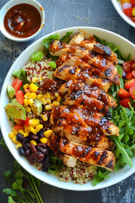 Grilled chicken salad with quinoa, black beans, corn, tomatoes, avocado, and arugula, drizzled with barbecue sauce. Quinoa Salad With Chicken, Bbq Chicken Quinoa, Bbq Chicken Bowl, Quinoa Chicken Salad, Fluffy Quinoa, Chicken Quinoa Salad, Clean Eating Detox, Restaurant Lunch, Tangy Bbq Sauce