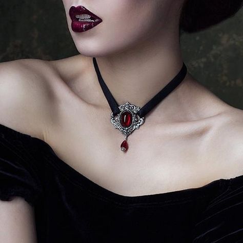 ● Gothic style ● Metal Choker ● Red Stone ●  This choker features a metal centerpiece with a beautiful red stone combined with black ribbon for contrast. The ribbon is finished off at the back securely with a lobster claw clasp and an extender chain which allows the choker to be worn at any size Rose Vampire, Victorian Choker Necklace, Goth Choker Necklaces, Victorian Gothic Jewelry, Victorian Choker, Gothic Choker Necklace, Red Choker, Gothic Choker, Goth Choker