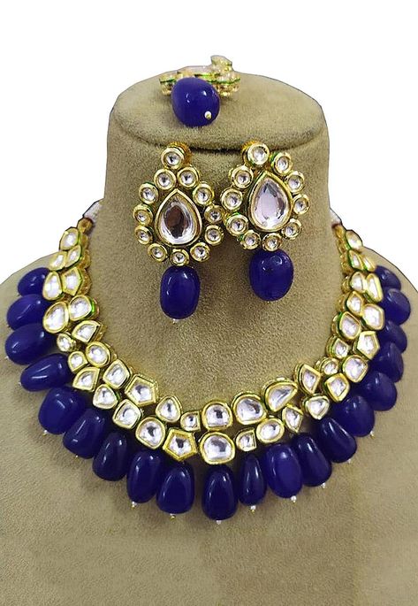 Alloy Based Choker Necklace in Royal Blue and White Adorned with Stones, Kundan and Beads Available with a Matching Pair of Earrings and a Maang Tikka The Necklace is Enclosed with an Adjustable Cord Blue Kundan Necklace For Festive Party, Festive Blue Kundan Necklace For Party, Blue Choker Necklace Indian, Blue Kundan Necklace For Celebration, Festive Blue Kundan Necklace, Blue Choker, Blue Sapphire Necklace, Layered Necklace Set, Choker Necklace Set