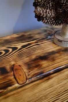 One of the most dramatic finishing effects is burning wood to bring out the grain. Here's a quick and fast project that highlights this distinctive technique. Burned Wood Finish, Burnt Wood Finish, Burn Wood, Torch Wood, Wood Floor Design, Burned Wood, Burning Wood, Charred Wood, Pine Table