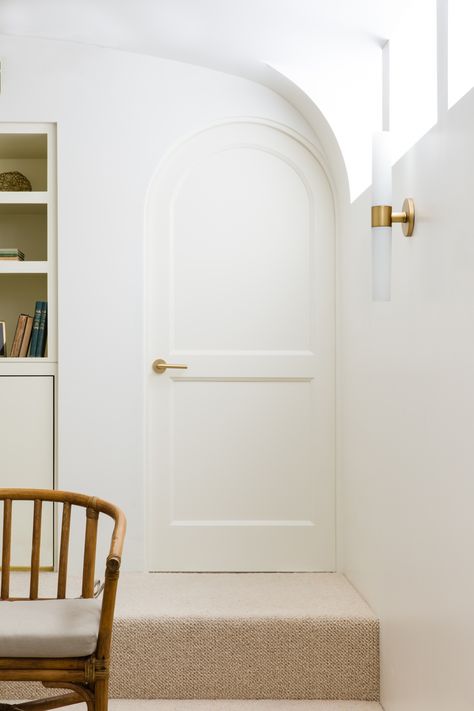 Through a petite rounded door and down a stair is the “theater,” adding to the vintage California feel. Palminteri opted for carpeting to allow for easy movement of the furniture, “for slumber parties,” she says. Rounded Doors Interior, Rounded Door, Hardware For Cabinets, Arched Interior Doors, Elegant Cottage, Cabinets Hardware, Arch Door, Arch Doorway, Desert House