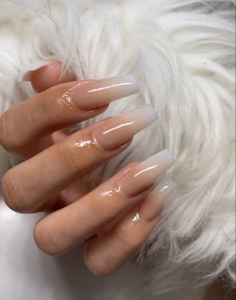 hand with acrylic nails that have nude ombré design against fur backdrop Tan Ombre Nails Acrylic, Ombre Tan Nails, Tan Ombré Nails, Nude Ombre Nails Coffin, Tan Nails Acrylic, Tan Ombre Nails, Tan Acrylic Nails, Classy Ombre Nails, Beige Ombre Nails