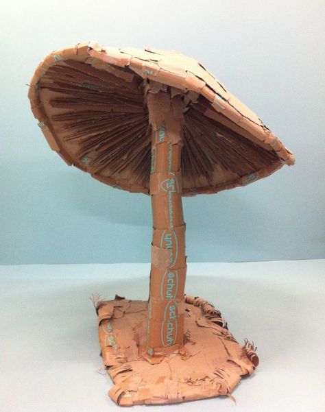 Cardboard mushroom. -More mushroom jokes anyone? Should we comment on the 'fun guy' just out of shot? Mushroom Jokes, Cardboard Mushroom, Paper Mache Mushroom, Cardboard Art Sculpture, Diy Moss, Alice In Wonderland Tea Party Birthday, Mushroom Crafts, Prom Decor, Cardboard Sculpture