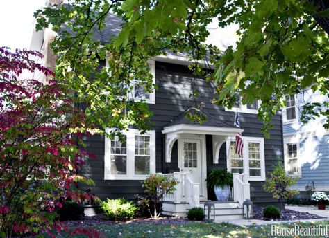 An almost black hue, Farrow & Ball's Railings modernizes the exterior of the 1920s Colonial. Steps Railing, Lakehouse Exterior, Home Designs Exterior, Home Exterior Makeover, Gorgeous Houses, Front Steps, Exterior Paint Colors For House, Exterior Makeover, House Color