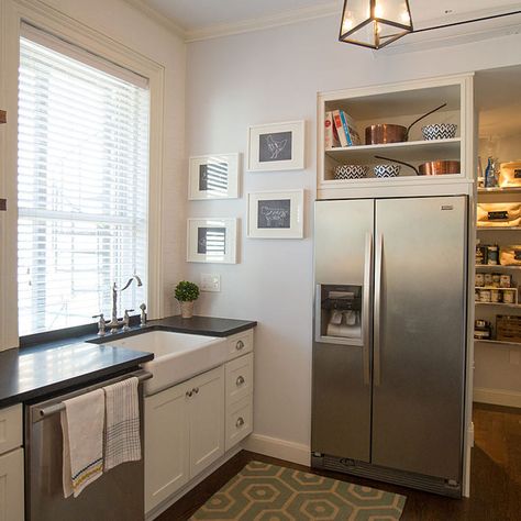 The homeowners weren't happy with an ordinary wall over-the-refrigerator cabinet, because they felt it would not adequately balance the beautiful range-wall on the opposite end of the room. Designer A.J. wisely suggested putting open shelving above the refrigerator to tie in with the open shelving already planned for the adjacent sink wall. Shelves Above Refrigerator, Space Above Refrigerator, Above Refrigerator Ideas, Townhouse Makeover, Above Refrigerator, Above Fridge, Refrigerator Ideas, Paint Cabinets White, Refrigerator Cabinet