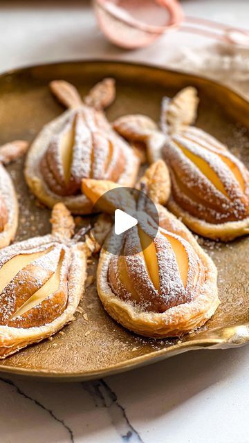 Zuliya Khawaja | Naturally Zuzu on Instagram: "Make these easy Vegan Puff Pastry Pear Tartlets for #mothersday 🩷 Only 4 ingredients!  1 package of puff pastry dough (2 sheets)  4 ripe Bartlett or Bosc Pears.  1/2 cup of light brown or raw unbleached sugar  Confectioners sugar for dusting  Method:  Preheat oven at 365 F  Slice pears in half, removed the center core seed. Cut slits on top of each pear halves. Dip each pear half in sugar then place it on top of puff pastry. Cut the pastry in pear shape leaving 1/2 inches from the edge. Sprinkle with some more sugar. Bake for 20 min or until golden brown. Dust it with confectioners sugar and enjoy.   #easyrecipes #recipeshare #taurusseason #pastry #tart #easydessert #dessertporn #recipe #plantbased #recipeoftheday #mom #brunch #veganchef #veg Pear Pastry, Puff Pastry Pear, Pear Tartlets, Vegan Puff Pastry, Mom Brunch, Puff Pastry Tart, Sliced Pears, Puff Pastry Dough, Vegan Chef