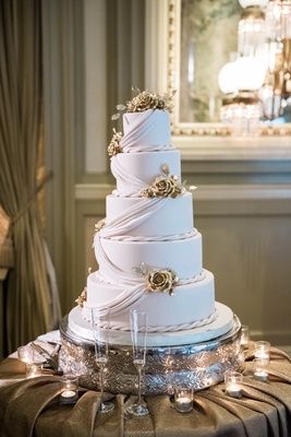 five-tiered wedding cake with fondant drapery and rope accents with golden flowers Ballroom Wedding Ceremony, Wedding Cake With Fondant, Elegant Ballroom Wedding, Cake With Gold, Elegant Ballroom, Golden Roses, Cake With Fondant, Cake Classes, Peonies And Hydrangeas