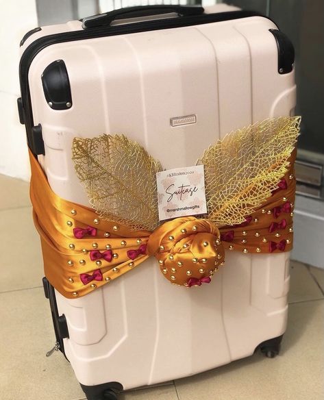 Beige Suitcase wrapped in a gold color theme for engagement dowry wrapping. Trousseau Packing, Bridal Boxes, Floral Art Arrangements, Wedding Gifts Packaging, Wedding Gift Wrapping, Suitcase Packing, Beautiful Quran Quotes, Wedding Bag, African Print Dresses