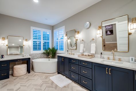 Elegant farmhouse bathroom with navy blue cabinets, gold accents, and beautiful tile design Bathroom Navy And Gold, Blue And Gold Bathroom Decor, Blue And Beige Bathroom, Blue And Gold Bathroom Ideas, Navy And Gold Bathroom, Blue And Tan Bathroom, Navy Blue And Gold Bathroom, Navy Blue Cabinets, Greige Bathroom