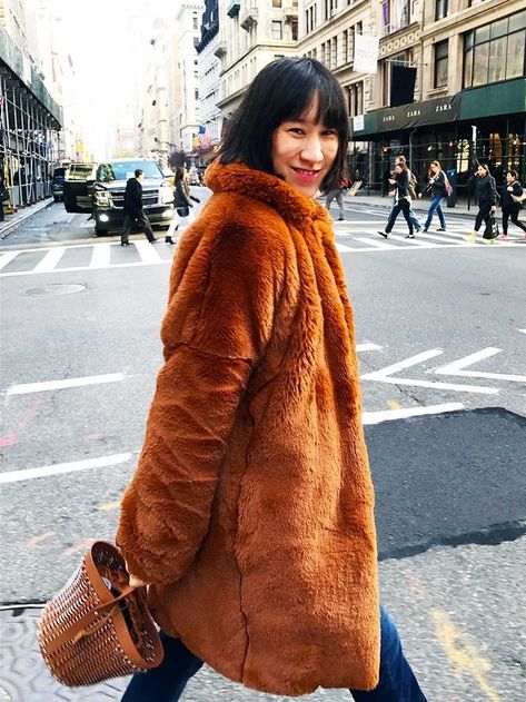 The Coat Fashion Bloggers Are Obsessed With via @WhoWhatWearUK Orange Fur Coat, Fur Coat Outfit, Eva Chen, Cozy Winter Fashion, Teddy Bear Coat, Coat Street Style, Statement Coat, Coat Trends, Coat Outfit